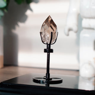 Faceted Smoky Quartz Flame on Black Metal Spinning Stand
